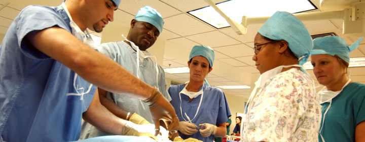 Surgeons and nurses performing an operation