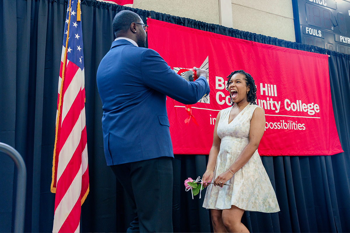 student receiving her pin