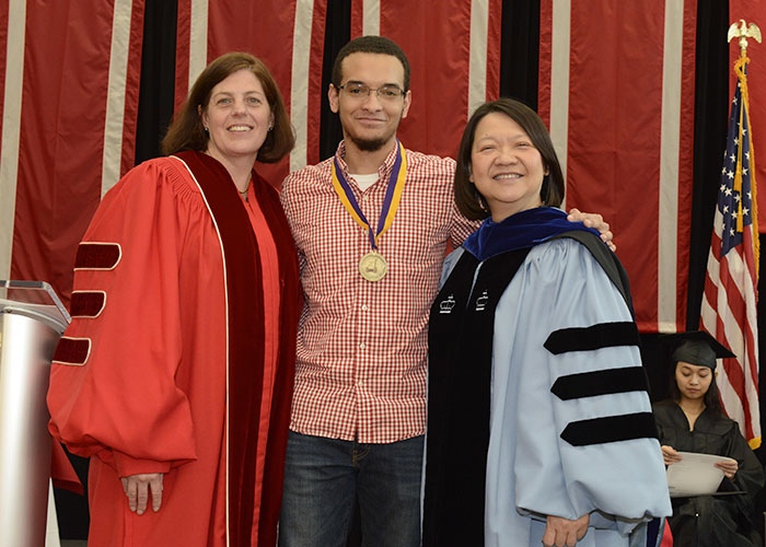 male commonwealth honors student with President Eddinger and Amy Young