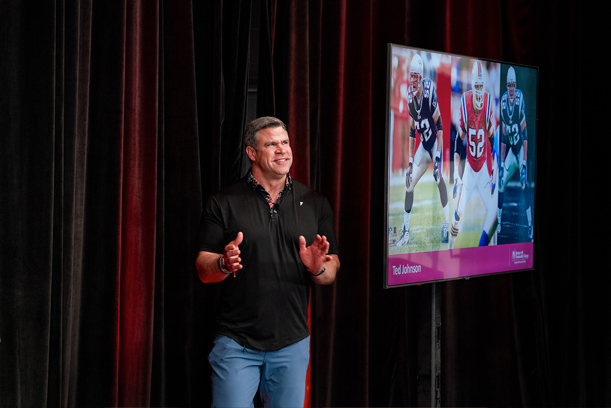 Ted Johnson speaking on stage