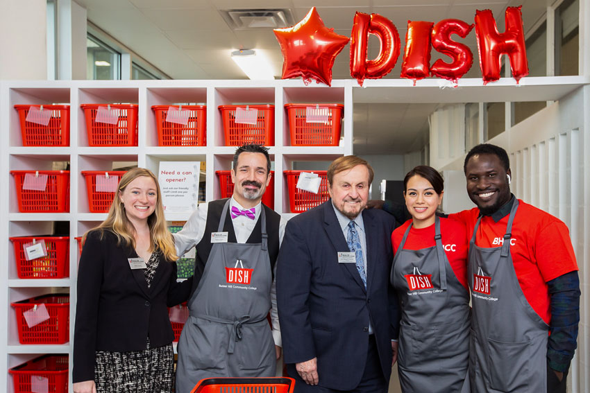 Dr. Caniff posing with DISH staffs