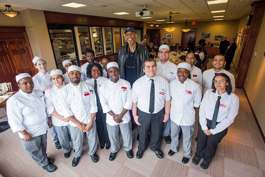 Kareem Abdul-Jabbar at lunch with BHCC Culinary Arts students.