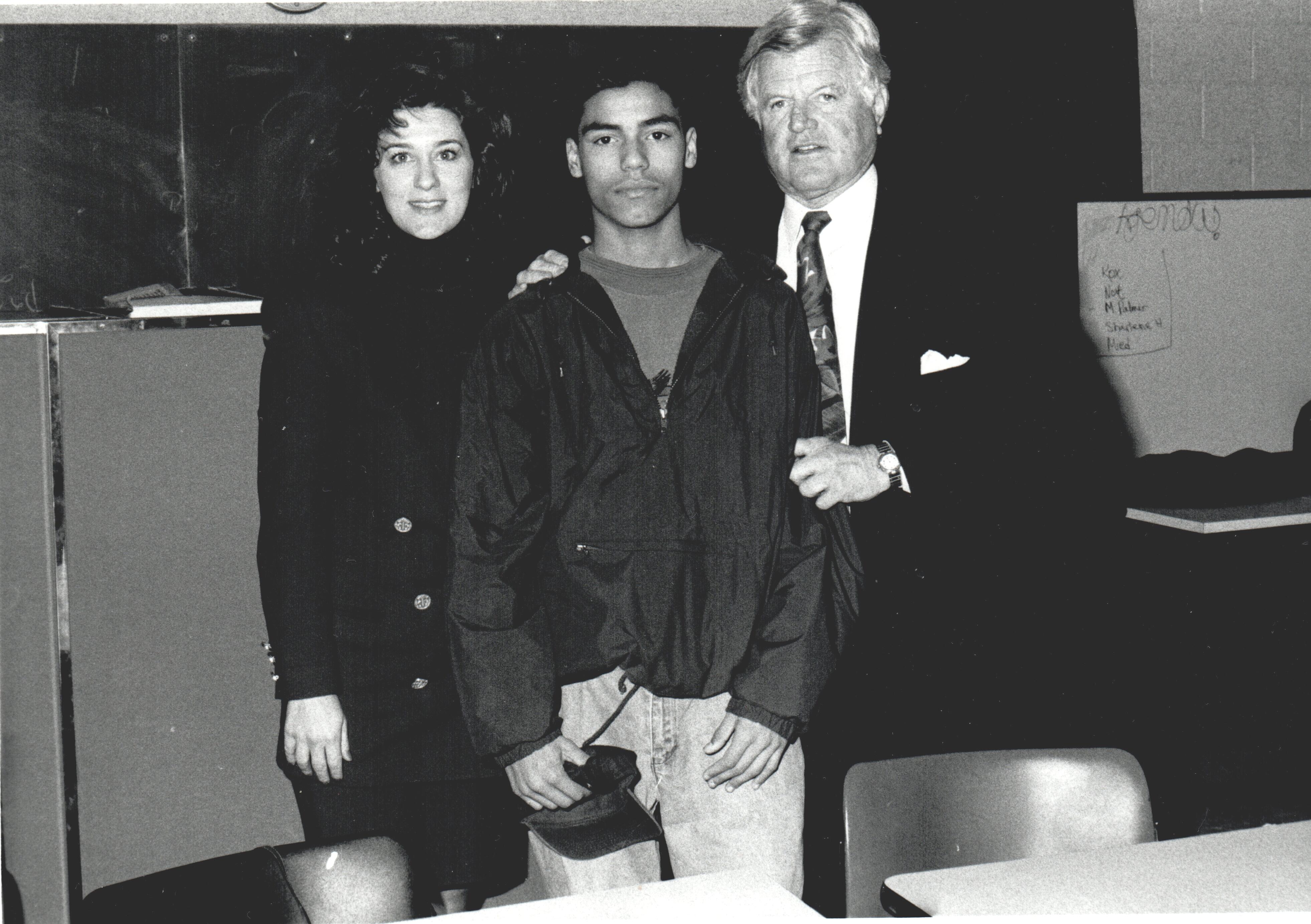 Ted_and_Vicki_Kennedy_with_student93.jpg - Black and white photo of Senator Ted Kennedy and his wife Vicki posing with a student