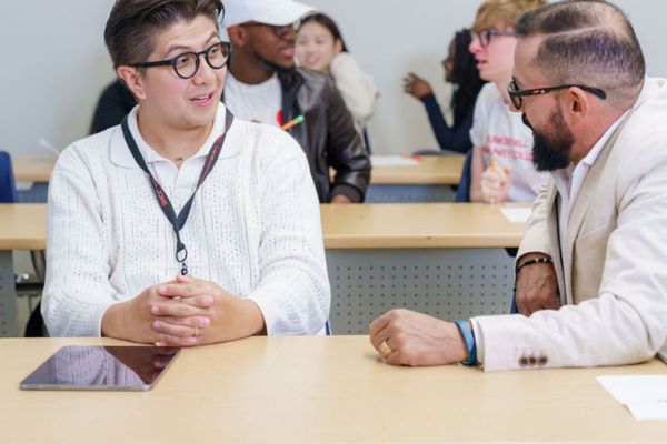 Student and teacher in a classroom