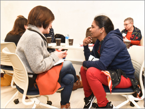 BHCC faculty Naoko Akai-Dennis and Bhanumathi Selvara connect in conversation during a workshop session.