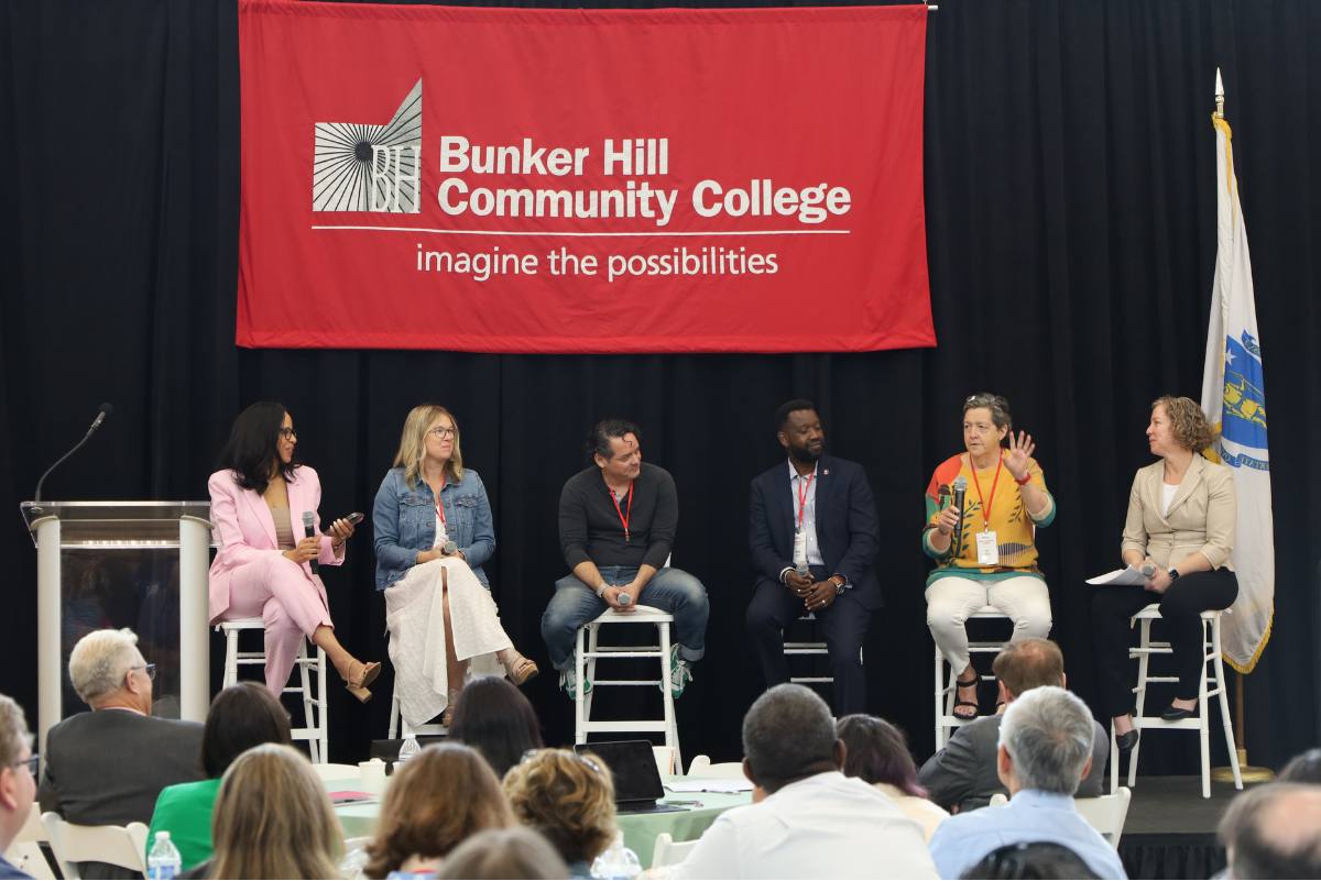 Convocation panel sitting on stage