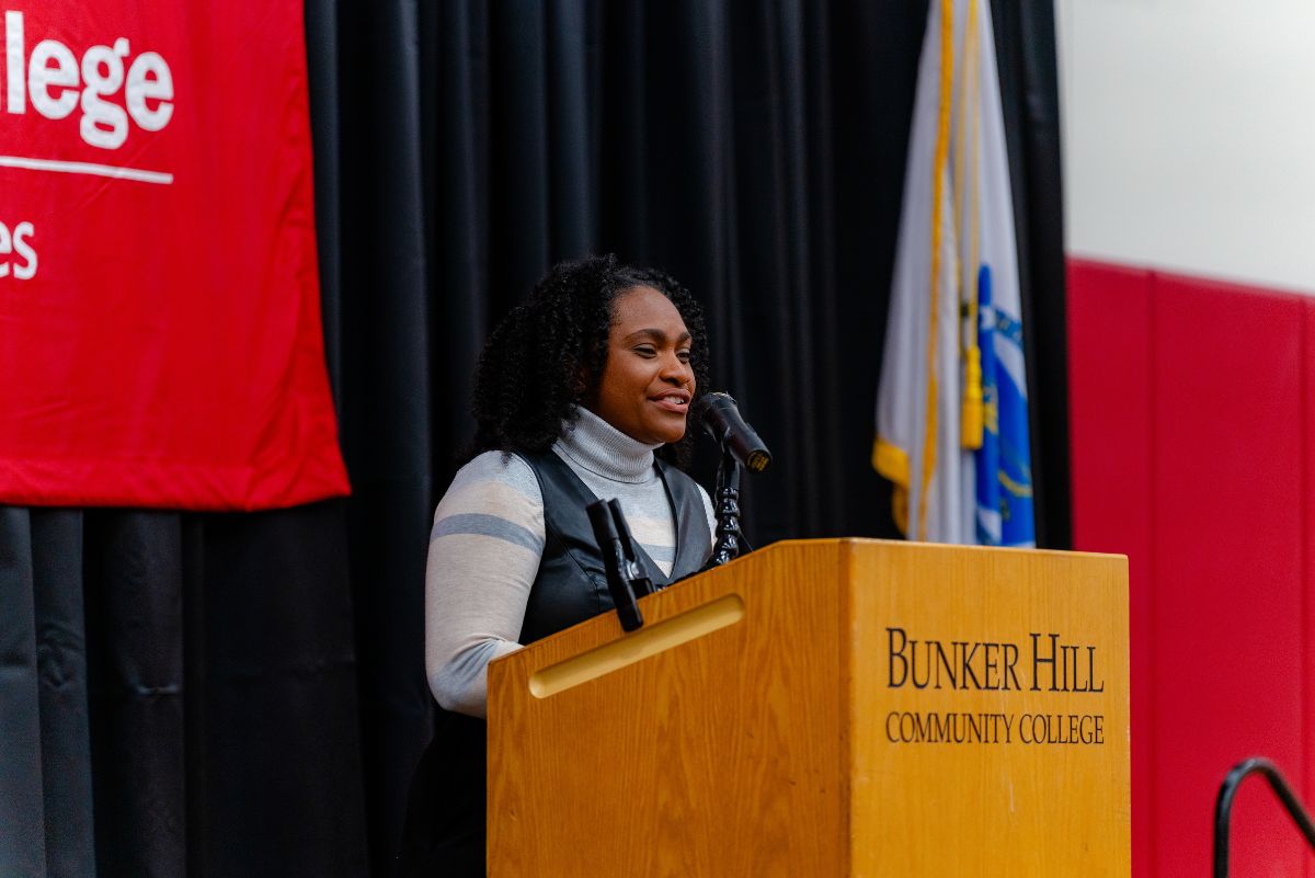 Nursing students speaking at podium