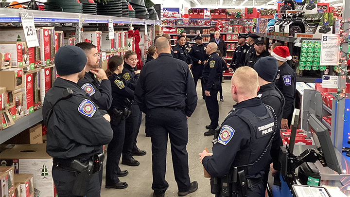 Officers at a store for a holiday event