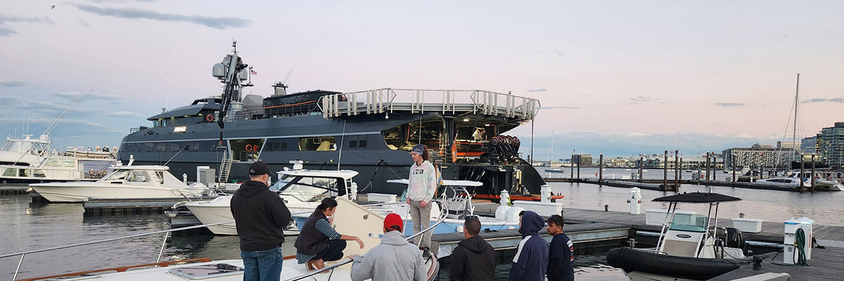 Students at the marina